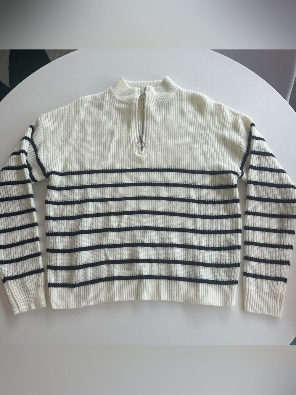 white + black striped quarter zip sweater
